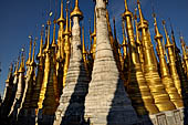 Inle Lake Myanmar. Indein, on the summit of a hill the  Shwe Inn Thein Paya a cluster of hundreds of ancient stupas. Many of them are ruined and overgrown with bushes. 